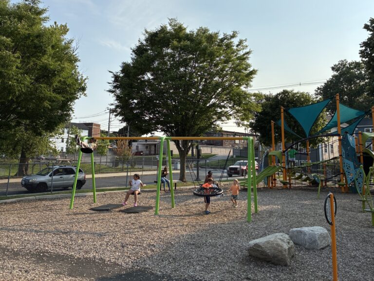 Richardson Park playground swings for ages 5-12 in action, August 2026
