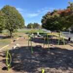 Richardson Park view of the playground from atop the large structure including spinners and ample seating