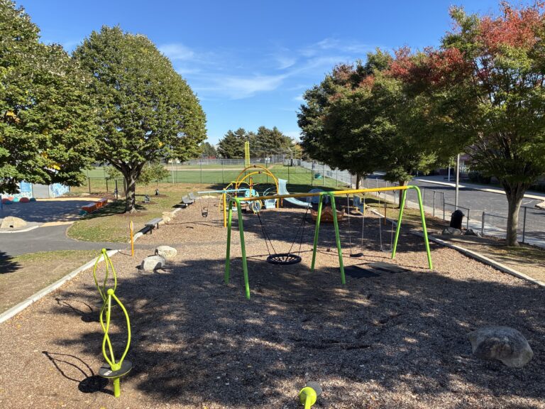 Richardson Park view of the playground from atop the large structure including spinners and ample seating