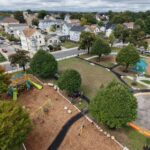 Richardson Park bird's eye view facing northwest over the playground and waterpark during the ribbon cutting ceremony on September 18, 2025