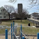 Ridge St Park view of south lawn and Ridge St entrance from on top of the playground structure