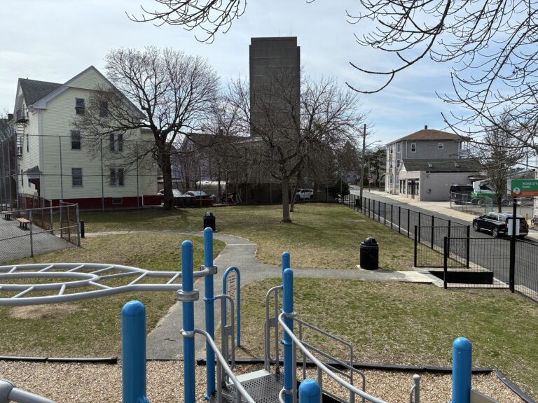 Ridge St Park view of south lawn and Ridge St entrance from on top of the playground structure