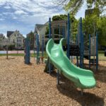 Ridge St Park playground for ages 2-12 features a curved slide