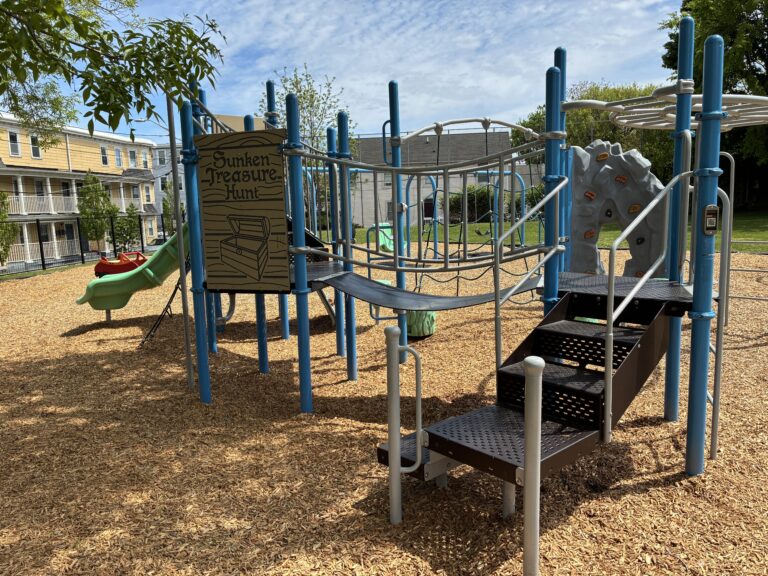 Ridge St Park playground for ages 2-12 features a belt bridge and sunken treasure hunt