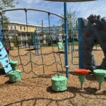 Ridge St Park playground for ages 2-5 cargo net and step pods