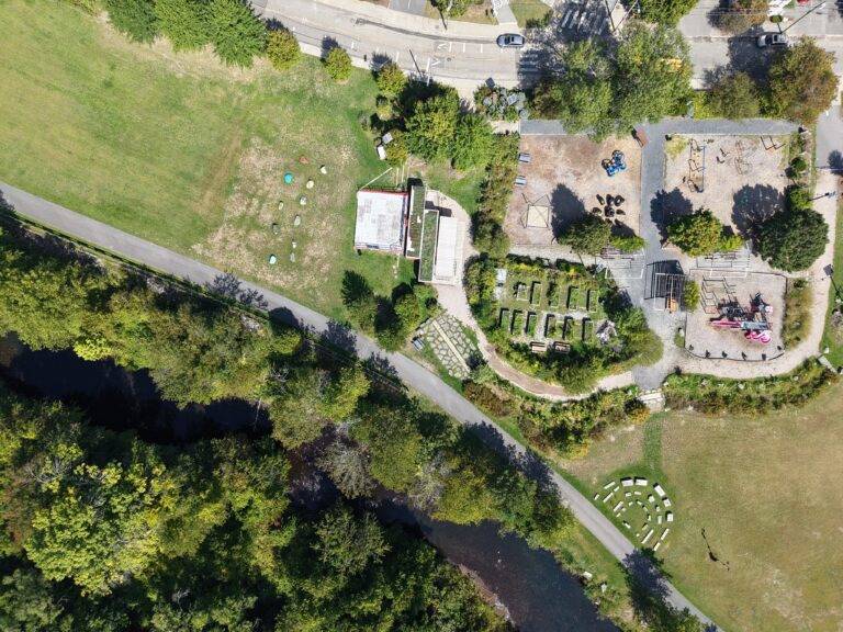 Riverside Park aerial photo in September 2025 showing the Woonasquatucket River that runs alongside the park