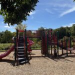 Riverside Park main play structure for ages 2-12 features 3 slides