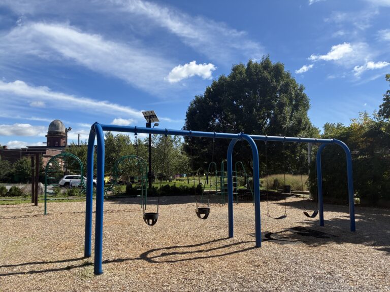 Riverside Park swings for ages 2-12 and classic climbing structures for ages 5-12