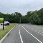 Roger Williams Park Softball Field Sign facing south to the parking lot entrance showing walk and bike lanes