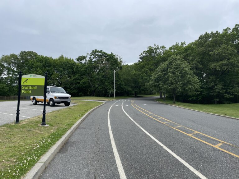 Roger Williams Park Softball Field Sign facing south to the parking lot entrance showing walk and bike lanes