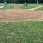Roger Williams Park Tim O'Neil Field 2 infield being groomed looking up the third base line from behind home plate