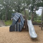 Roger Williams Park Bear Ground looking up the slide and past the play sculpture to Maple Ave