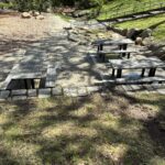 Roger Williams Park Bear Ground picnic area features 3 tables one of which is ADA-accessible