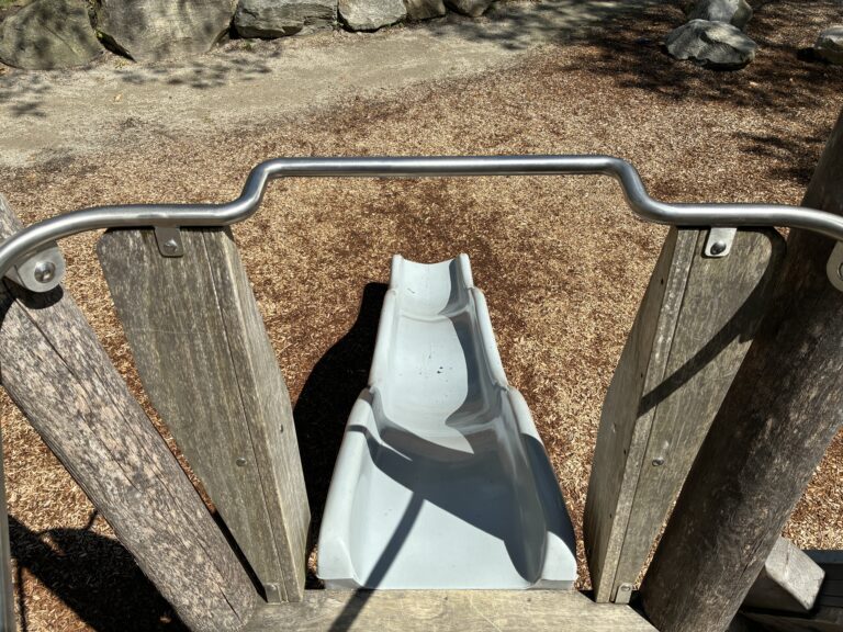 Roger Williams Park Bear Ground play sculpture looking down the slide from the top deck