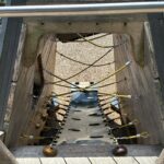 Roger Williams Park Bear Ground inside the play sculpture are ropes, belts, and rock climber style handholds to access the slide deck