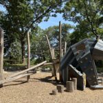 Roger Williams Park Bear Ground play sculpture features rock climber style handhold panels and log climbing structures
