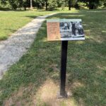 Roger Williams Park Bear Ground interpretive sign and stone dust path to the play area