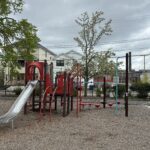 Warren St Park play structure for ages 5-12 features a classic metal slide